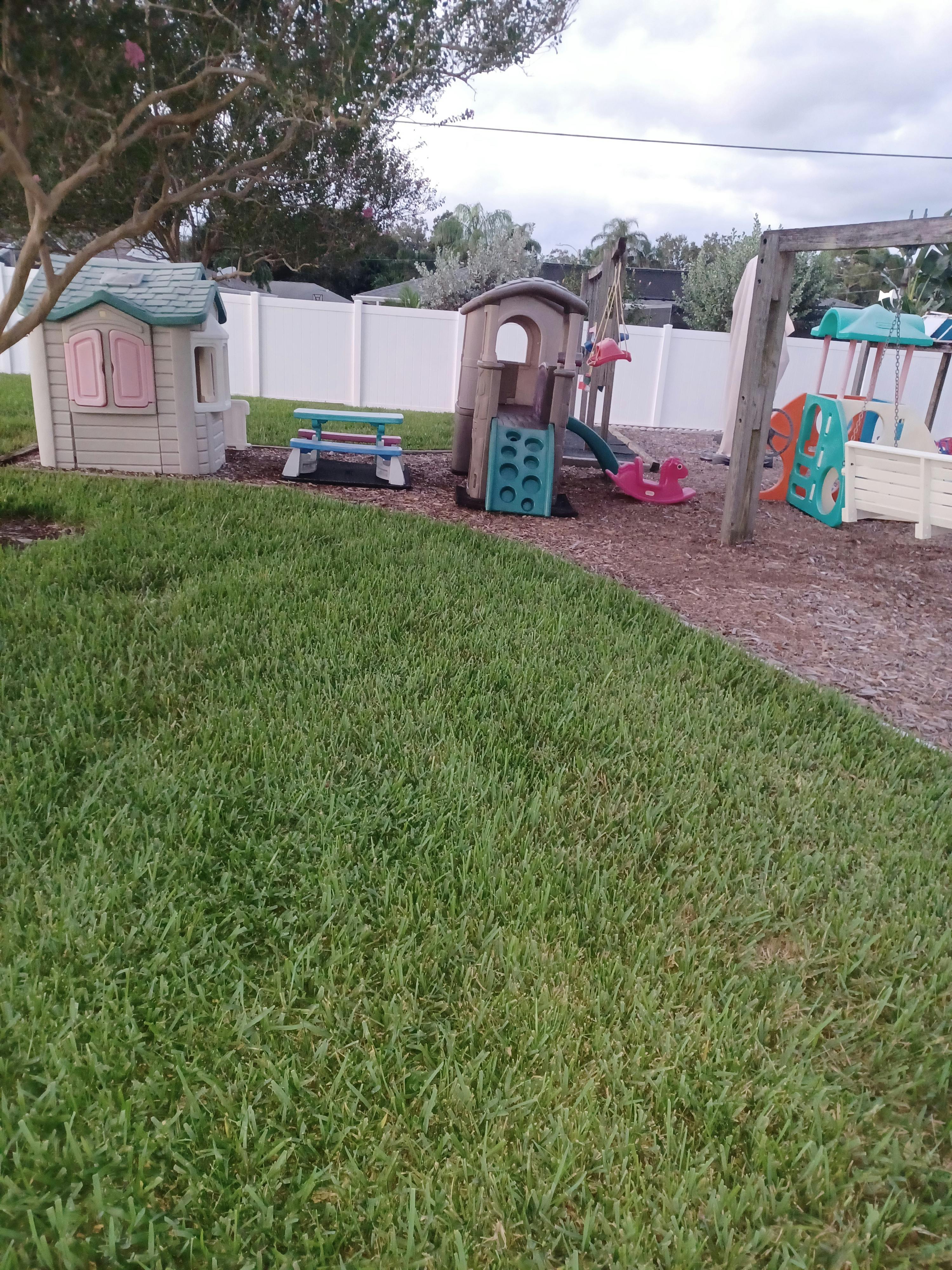 Playground with playhouses, slides, and swings