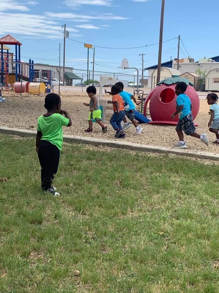 Children running on a playground