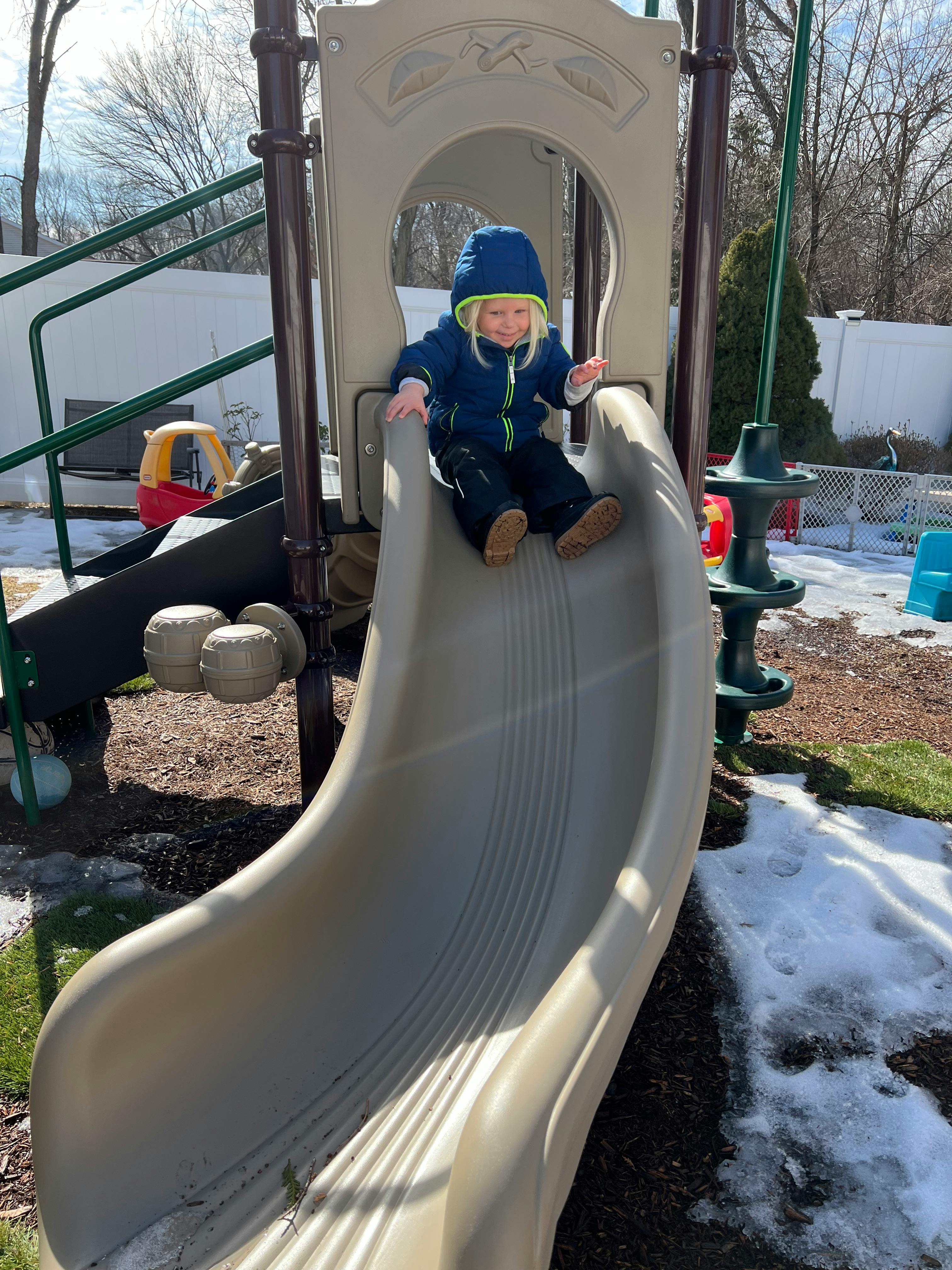 Child on a playground slide