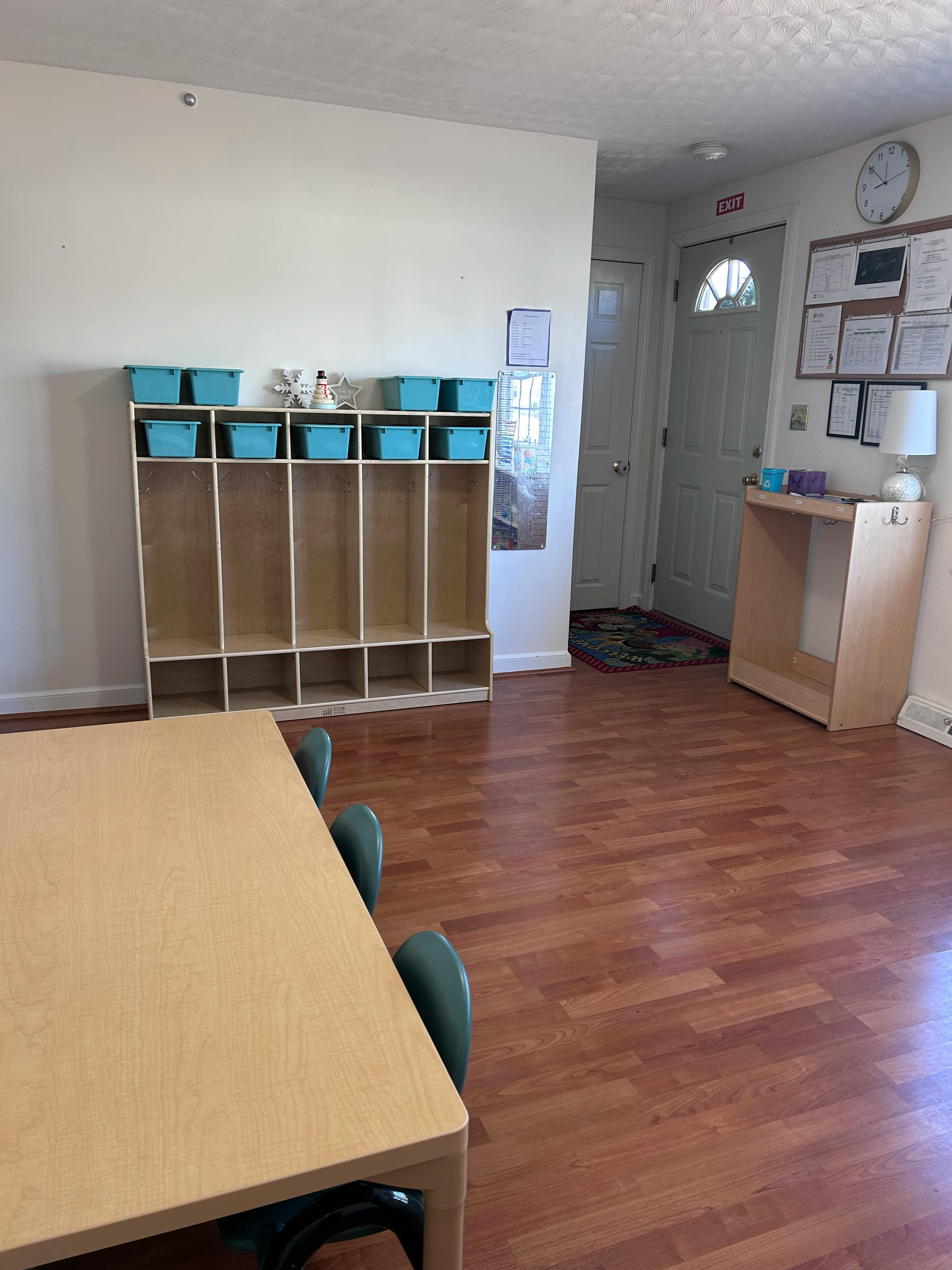 Classroom with cubbies, table, and chairs