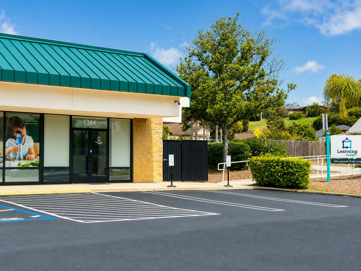 Exterior of Learning Jungle child care center with parking lot