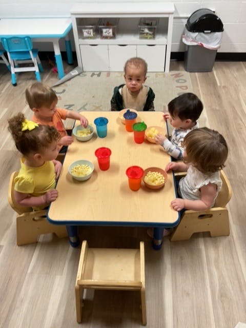 Children eating snacks at a table