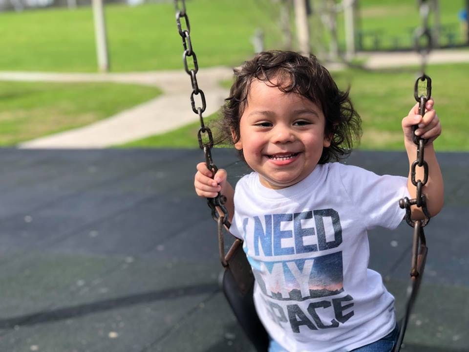 Child on a swing at a playground