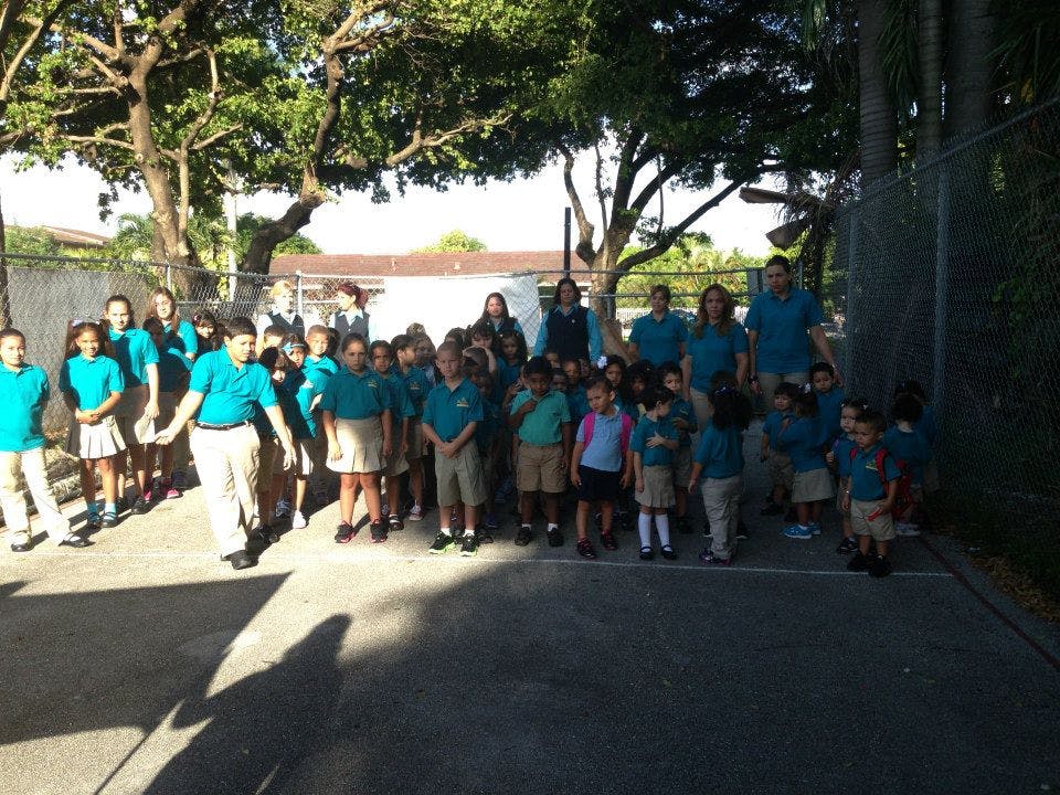 Group of children and adults standing outdoors