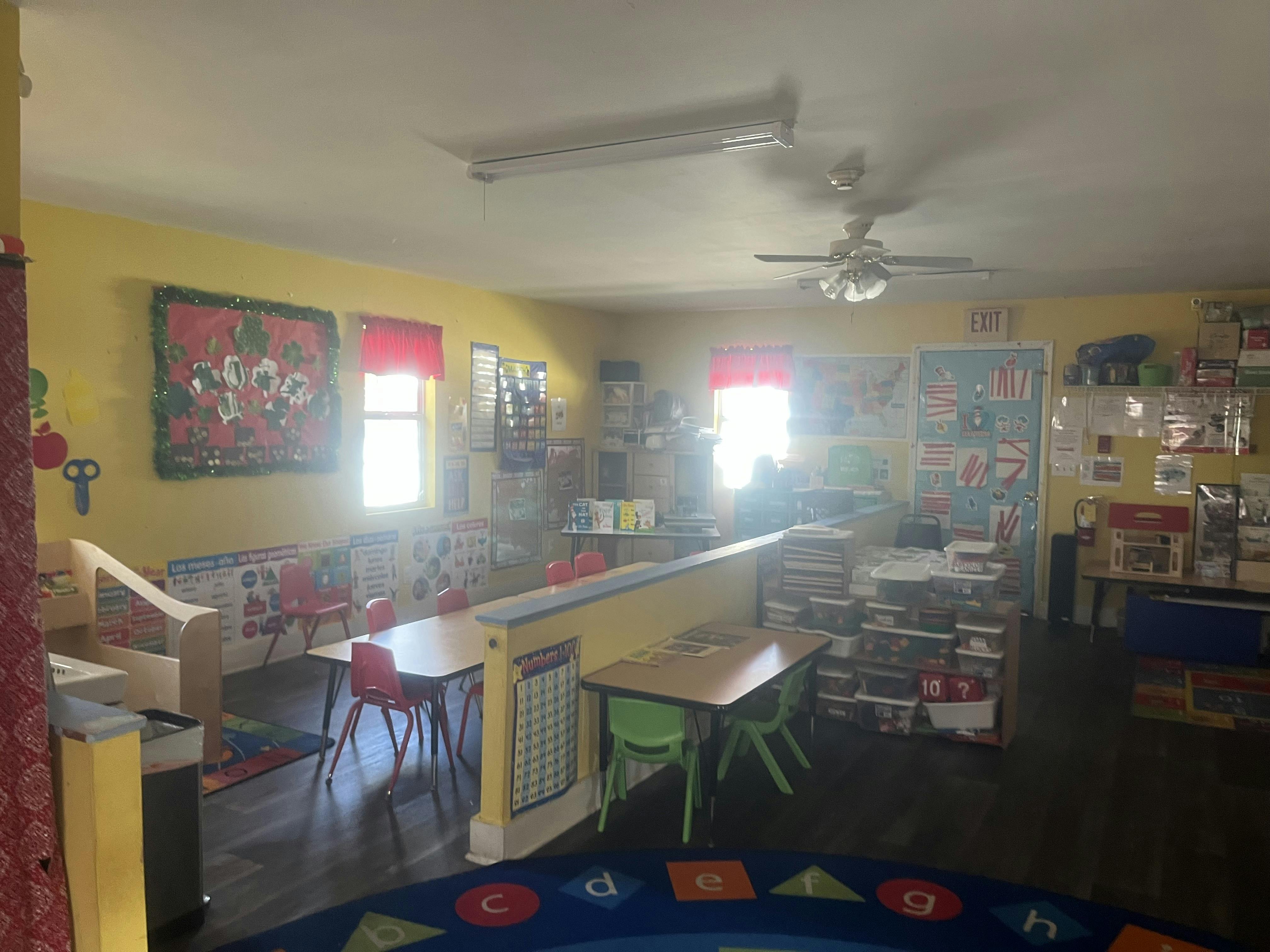 Classroom with tables, chairs, and learning materials