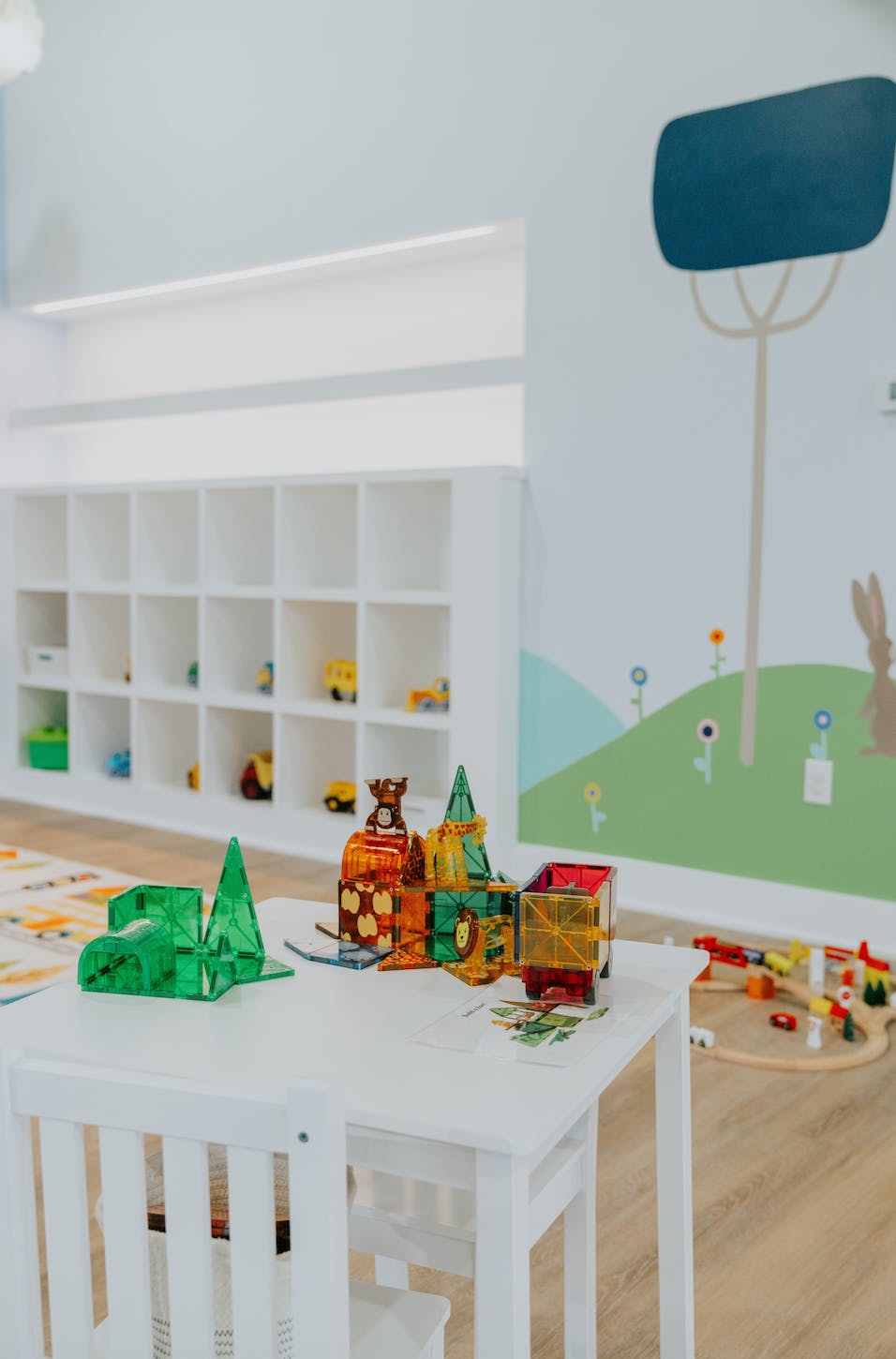 Magnetic building tiles on a white table in a playroom