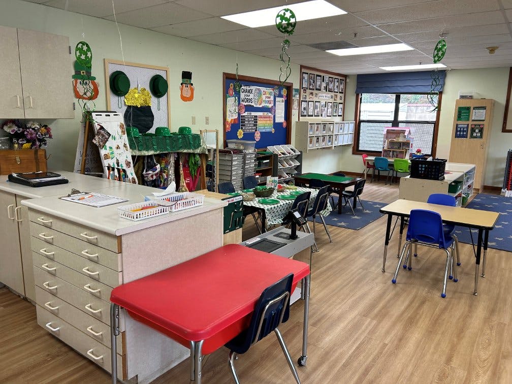Classroom decorated with St. Patrick's Day theme, small tables and chairs