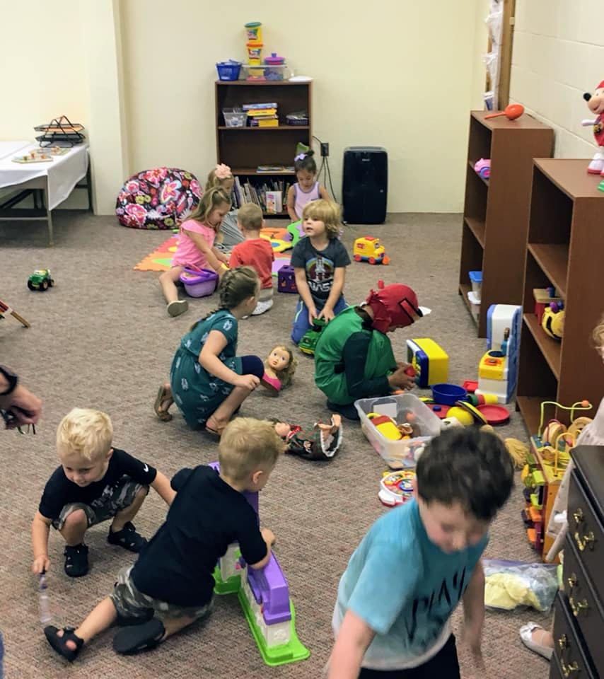 Children playing with toys in a room