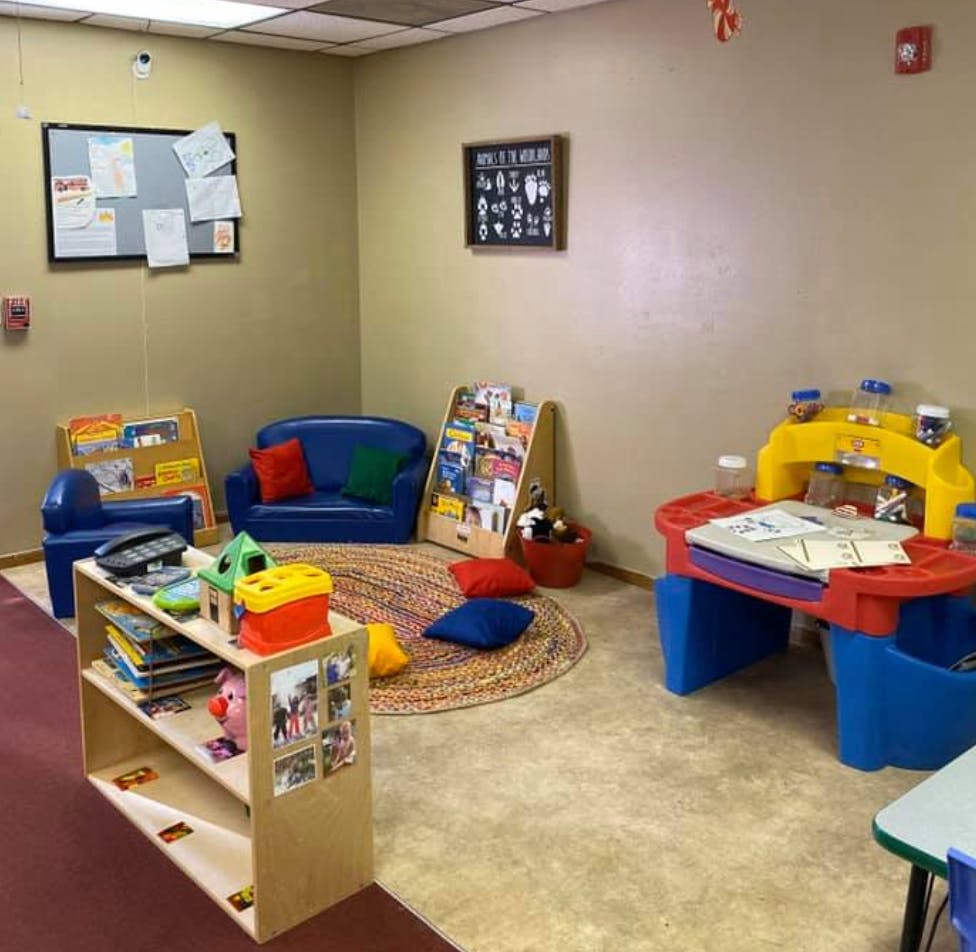 Children's play area with small furniture and toys