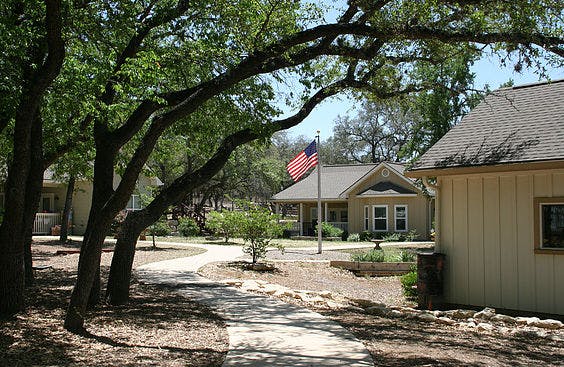 Path leading to a building with an American flag flying