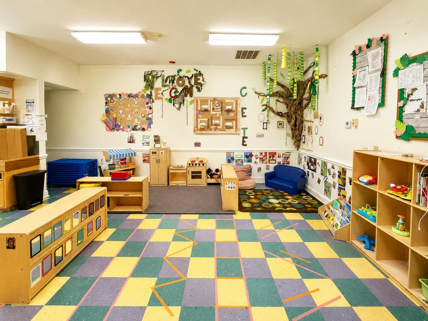 Classroom interior with play equipment and educational wall decorations