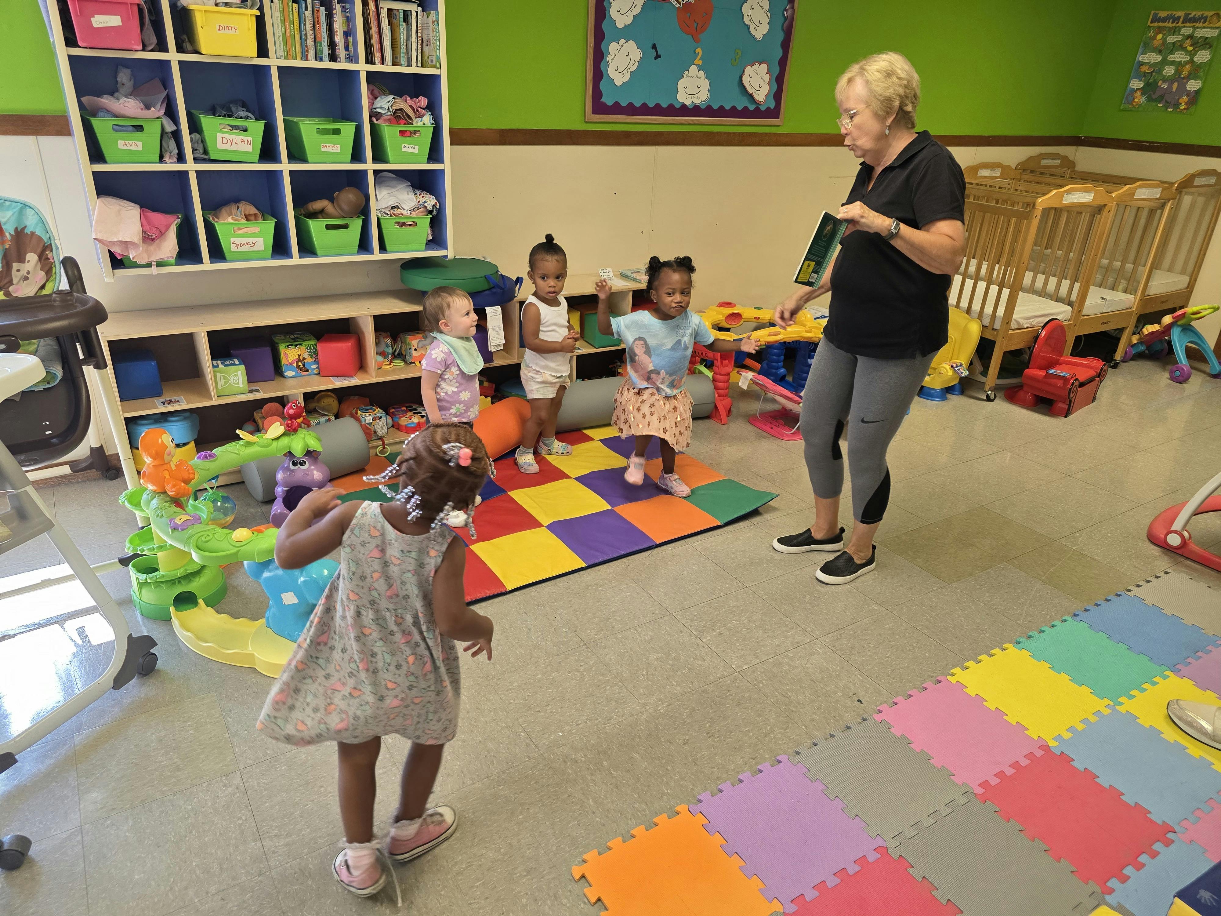 Adult and children in a classroom