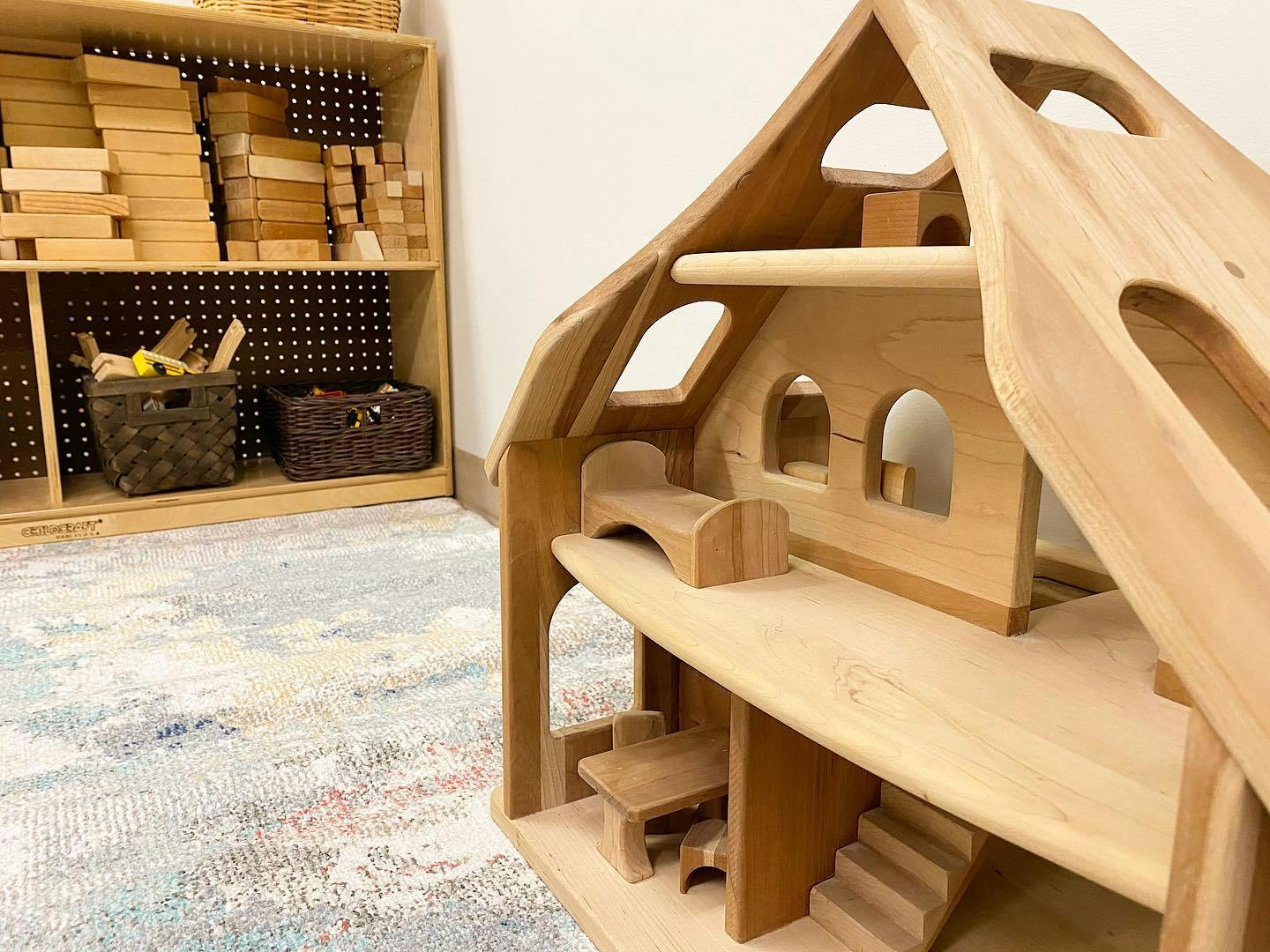 Wooden dollhouse with miniature furniture