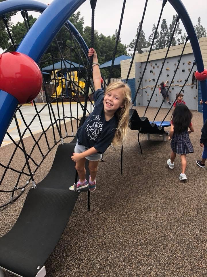Child on a playground climbing structure