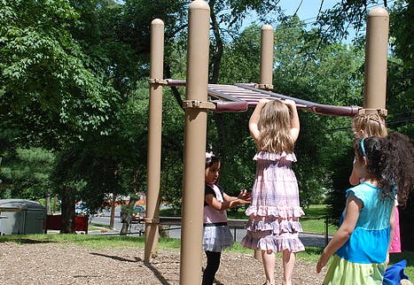 Children playing on playground equipment