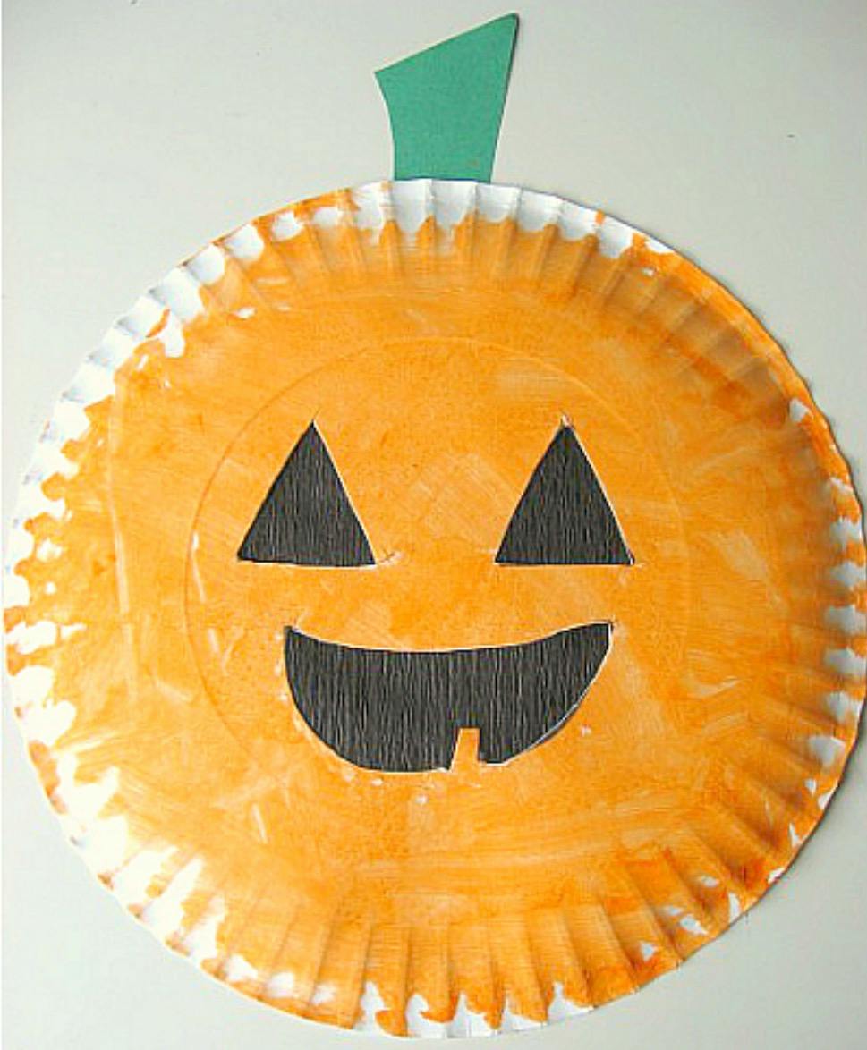Jack-o-lantern craft made from an orange painted paper plate
