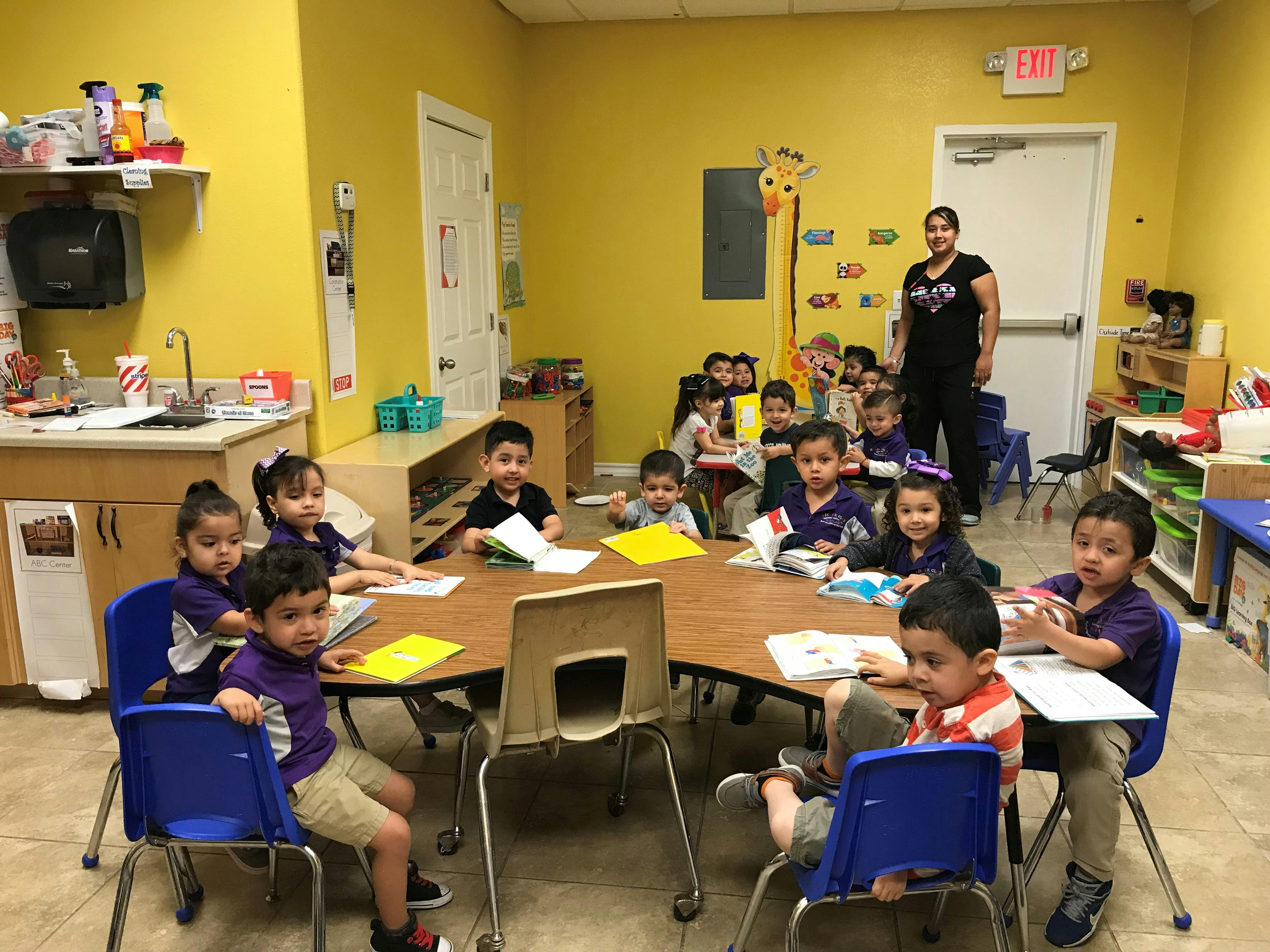 Children and an adult in a classroom