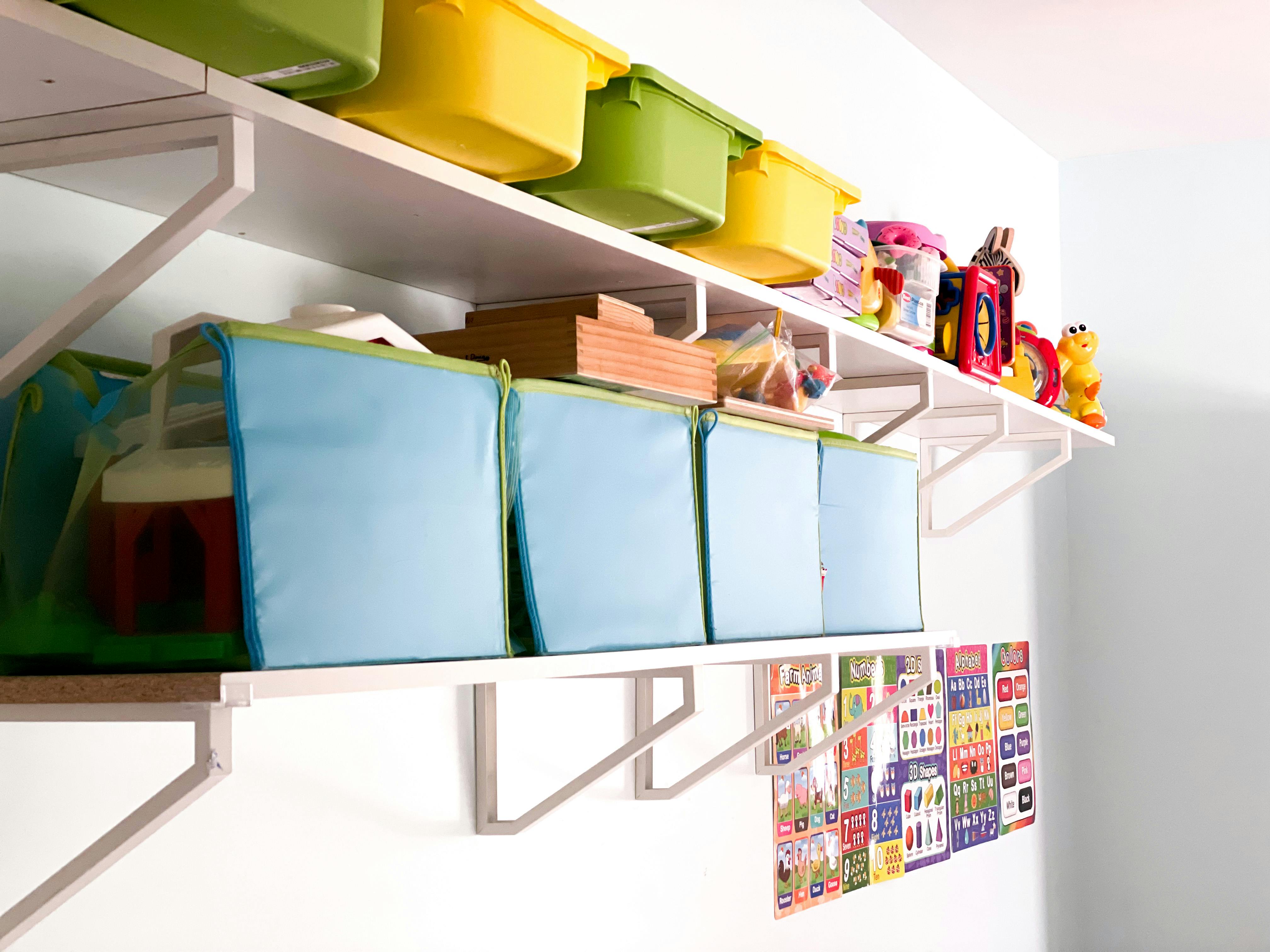 Shelves with storage bins and toys