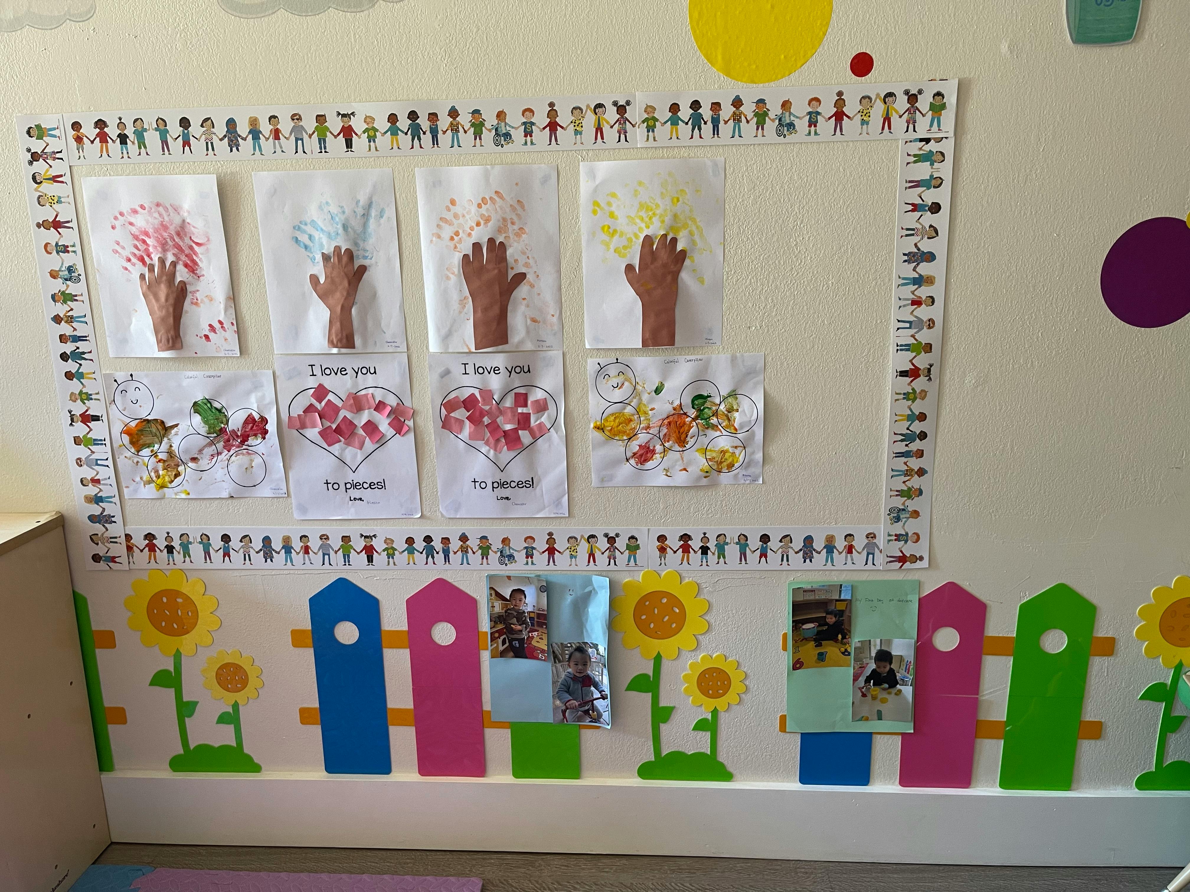 Children's artwork displayed on a wall