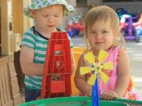 Two children playing with toys