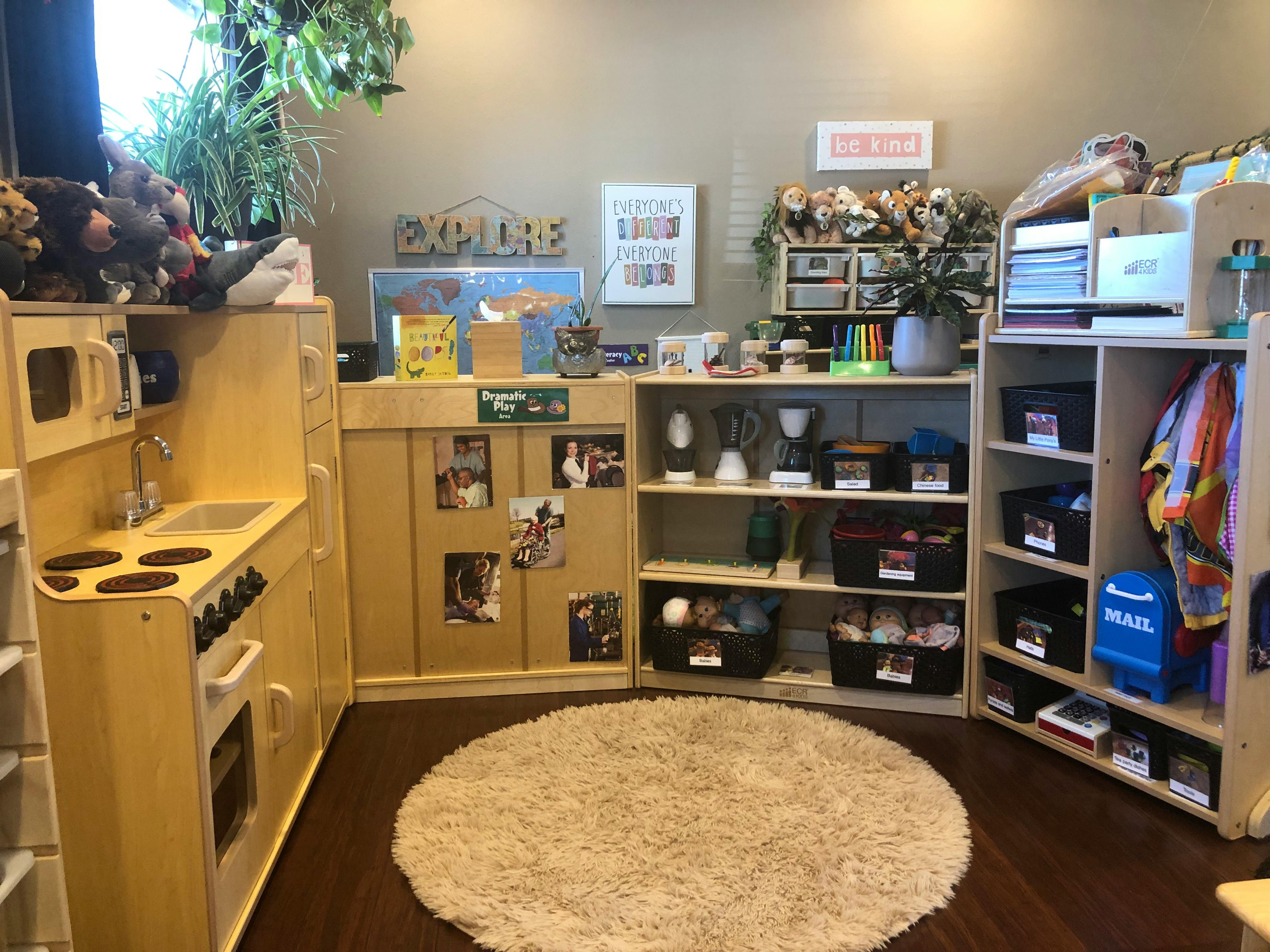 Play kitchen and shelves with toys in a classroom