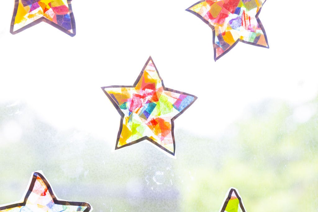 Colorful star-shaped cutouts on a window