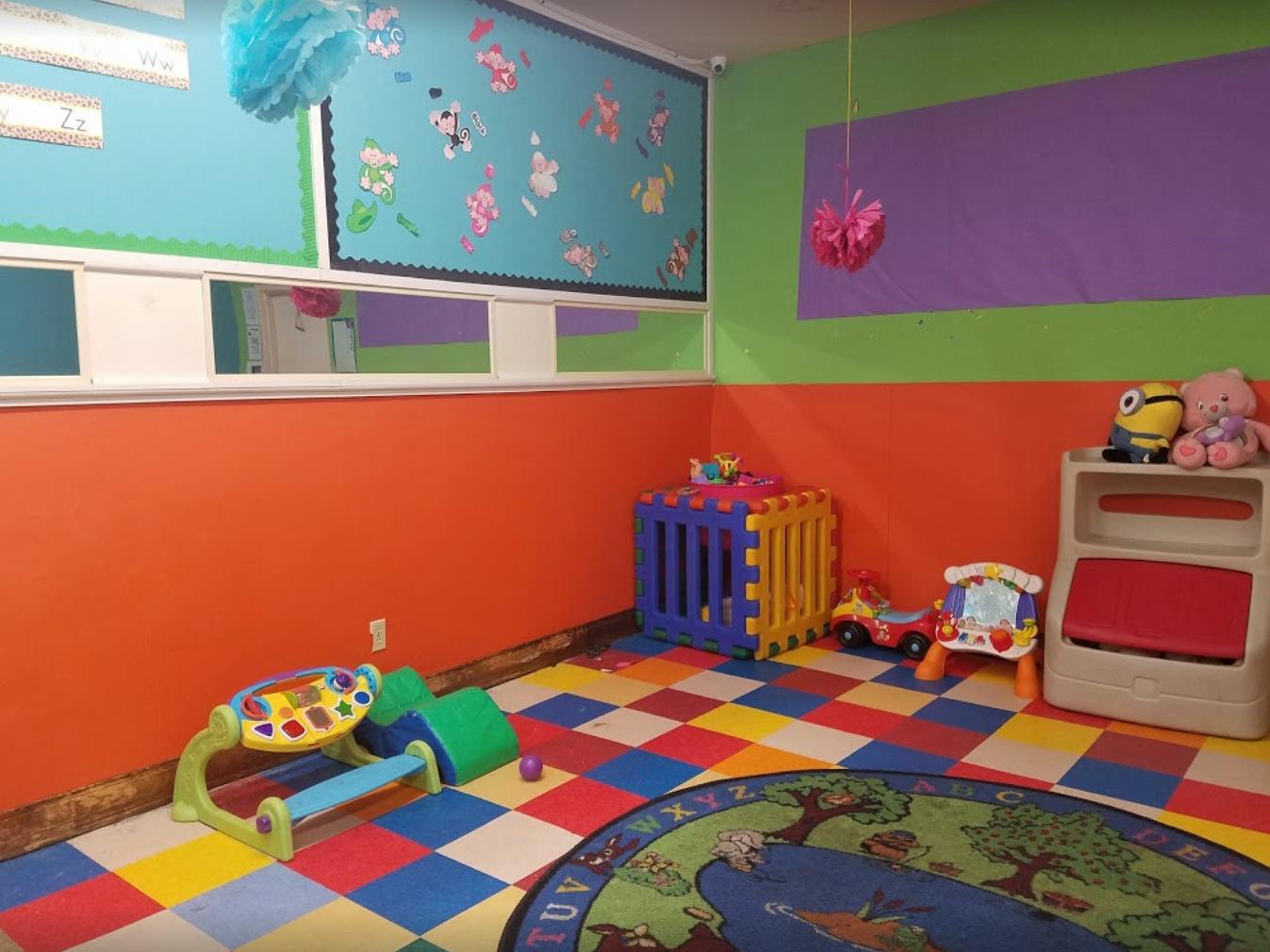 Playroom with colorful walls, checkered floor, and various toys