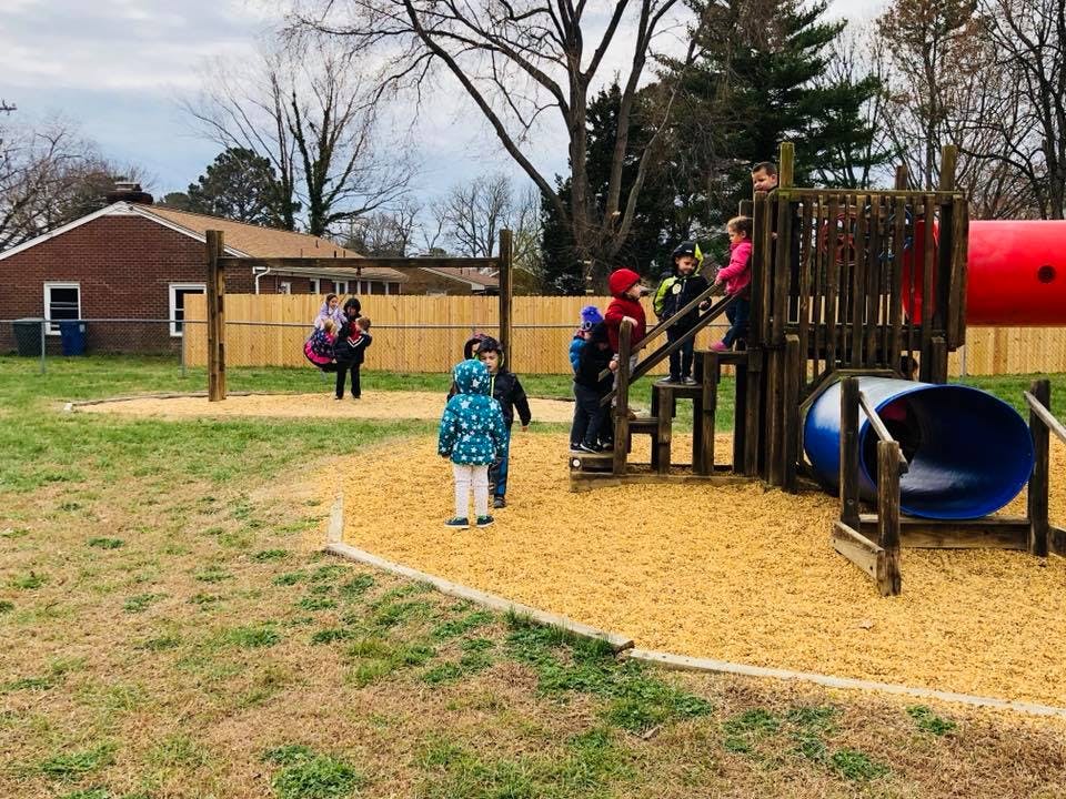 Children playing on a playground structure