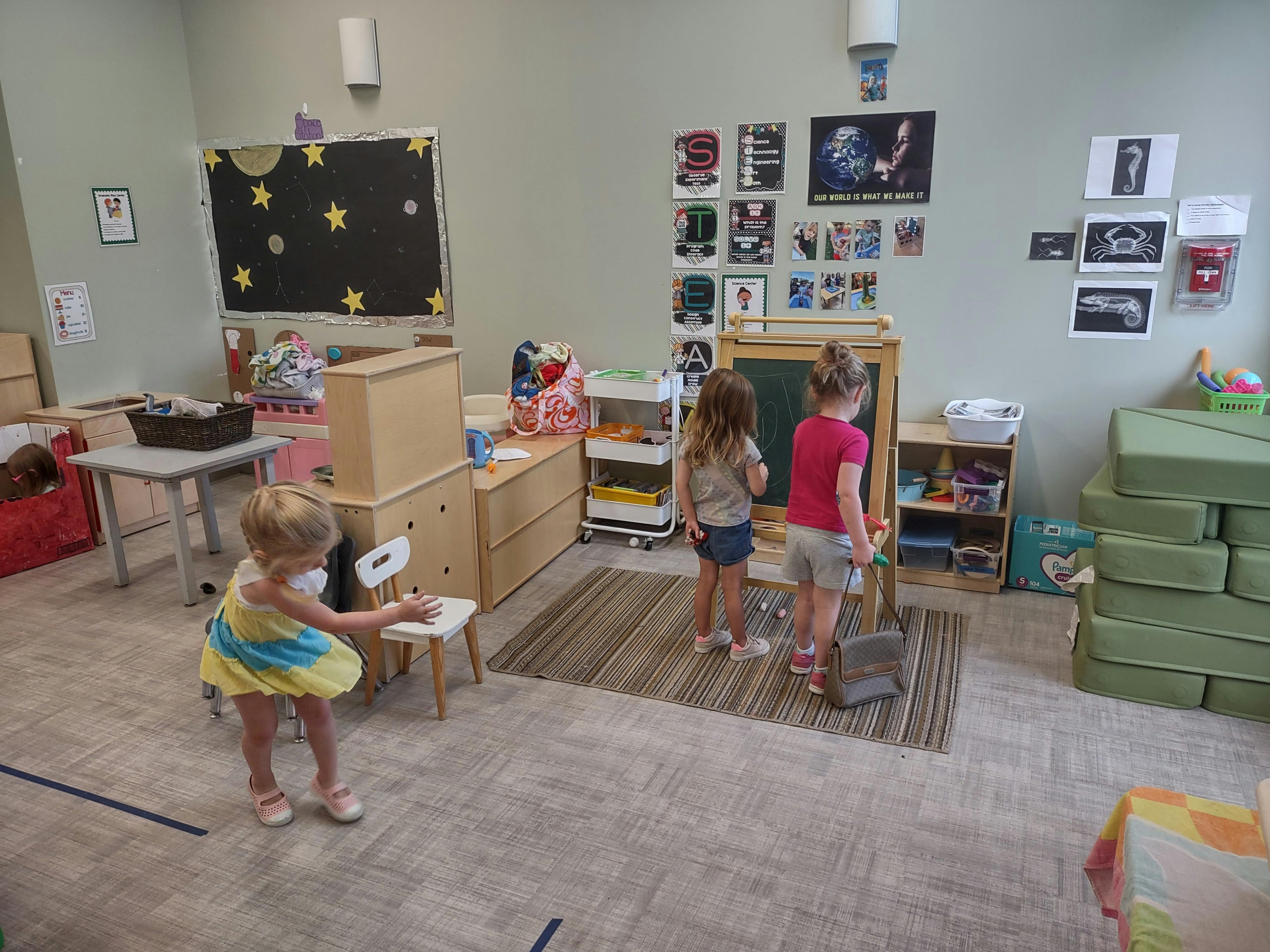 Three children in a classroom