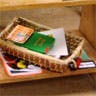 Woven basket with papers and other items