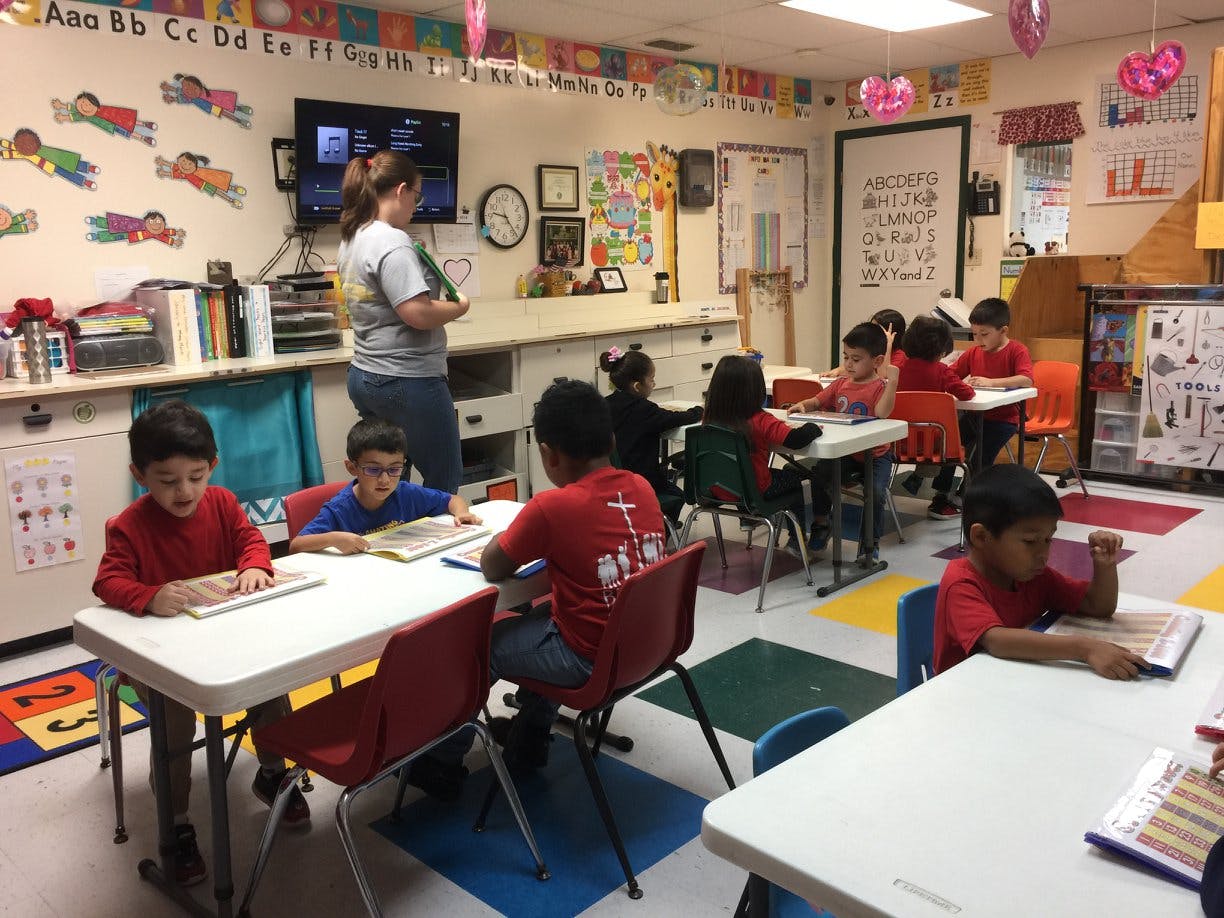 Adult and children in a classroom