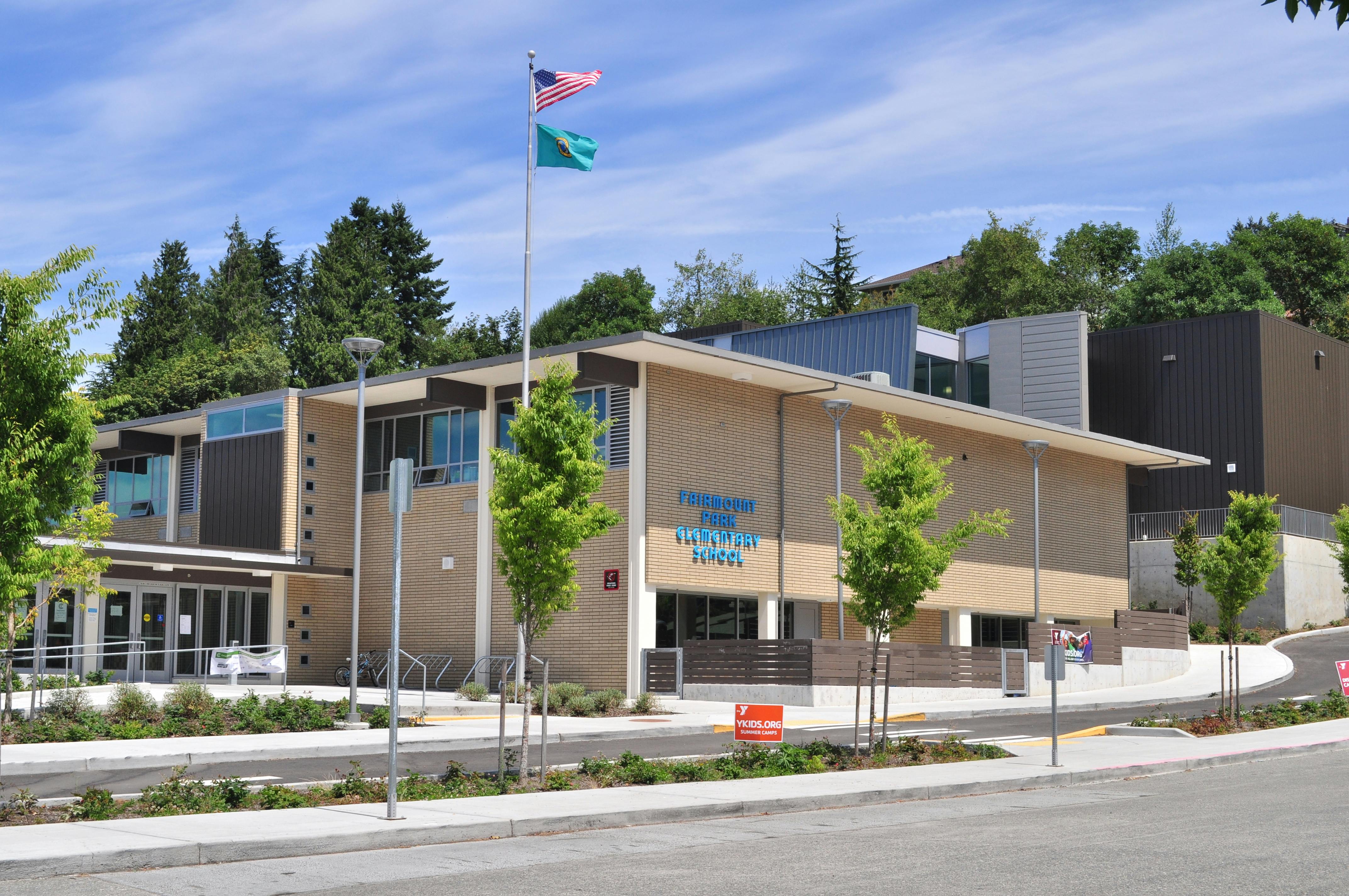 Modern building with a flag pole and two flags flying