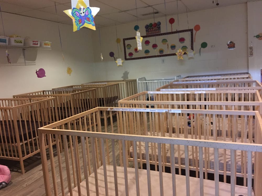 Room with multiple empty cribs