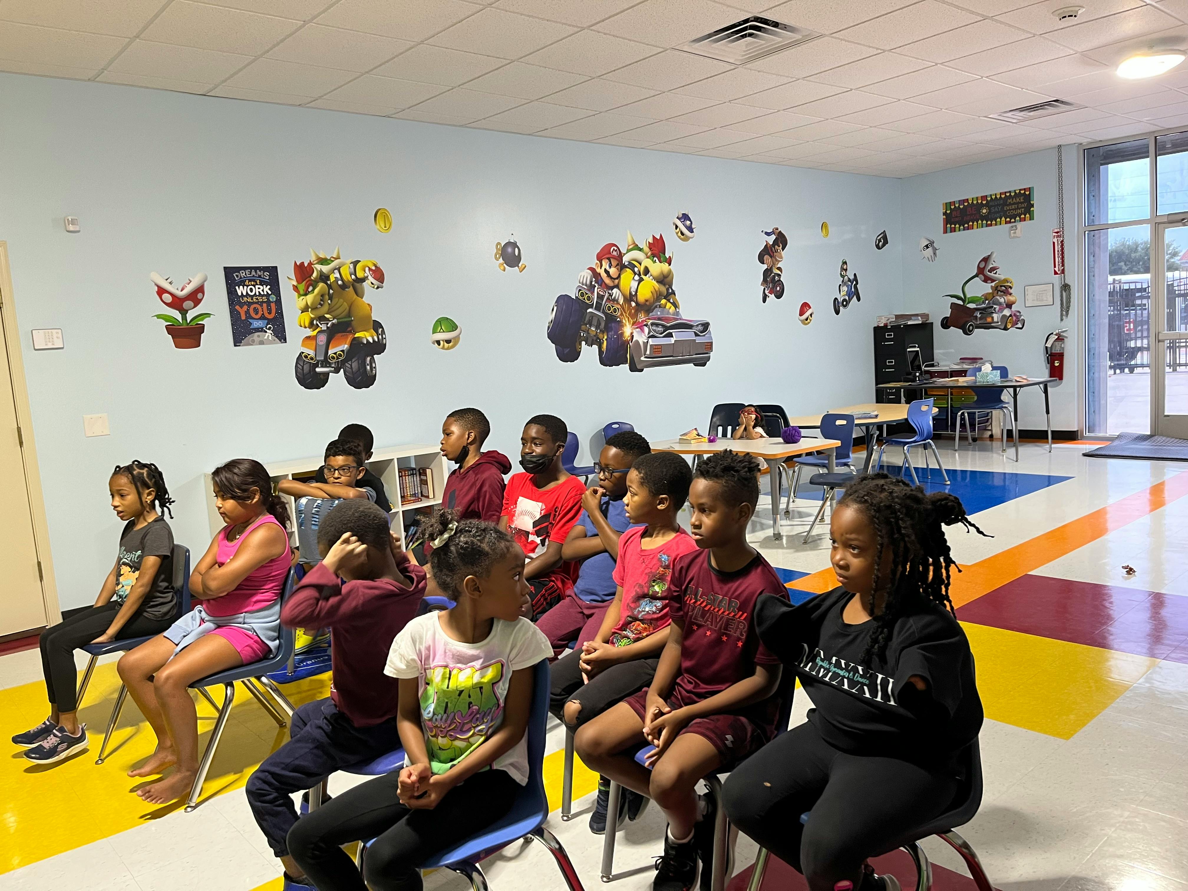 Group of children sitting in a classroom