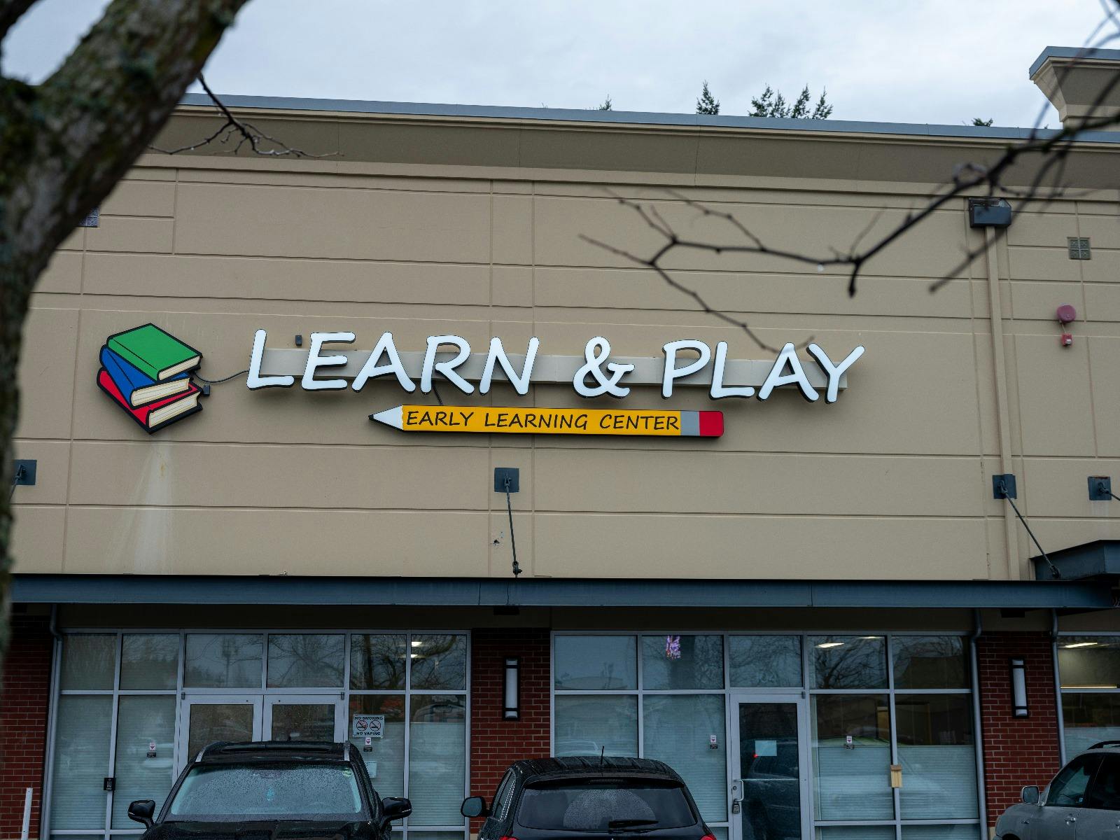 Learn & Play Early Learning Center sign on a building facade