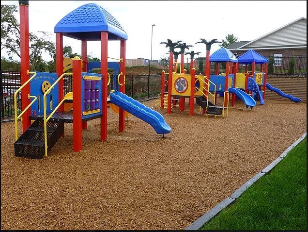 Colorful playground with slides and climbing structures