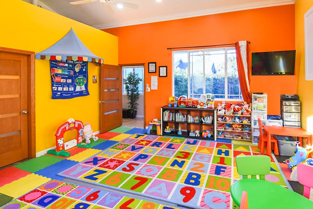 Playroom with colorful alphabet and number floor mats