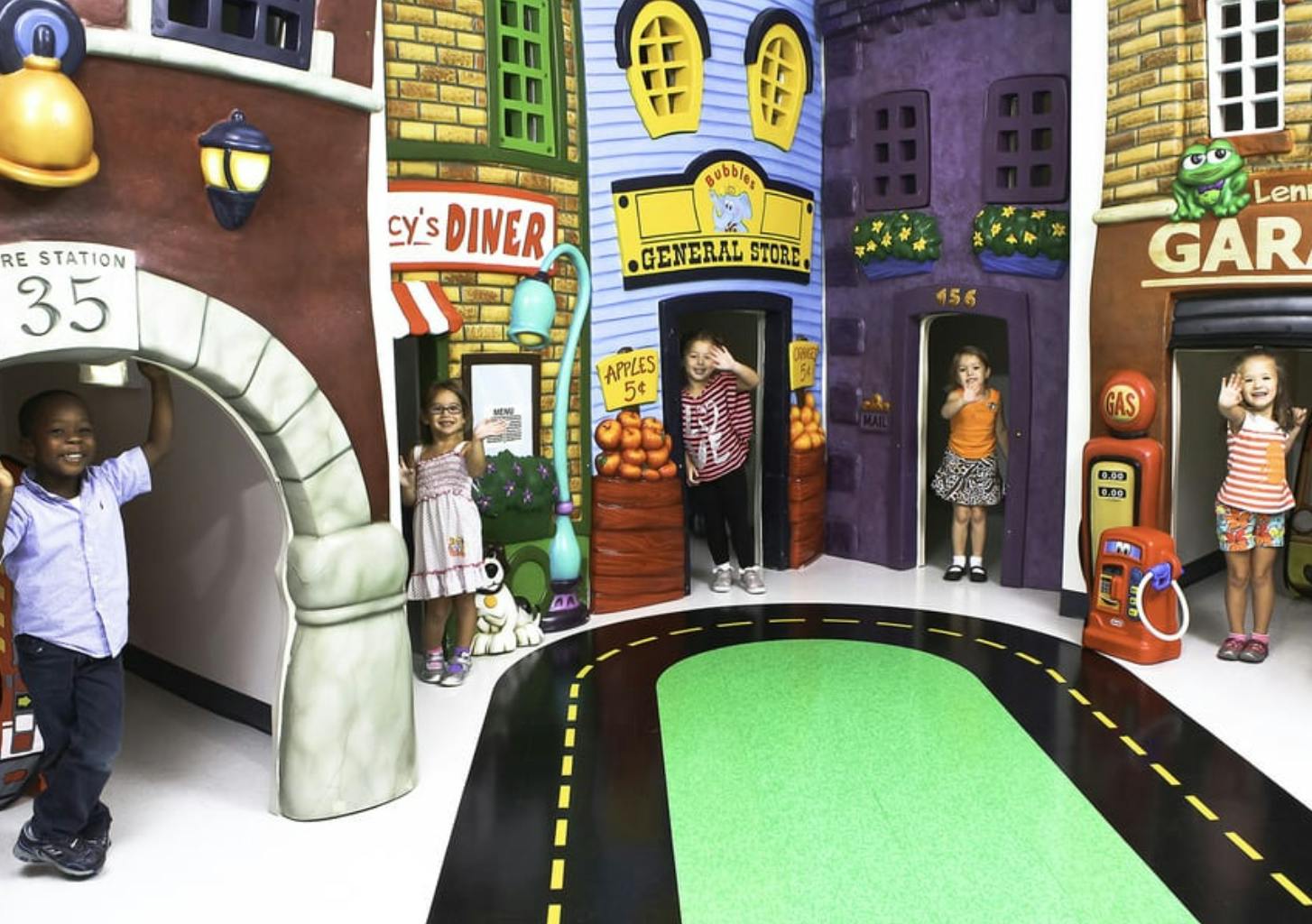 Children playing in a miniature town