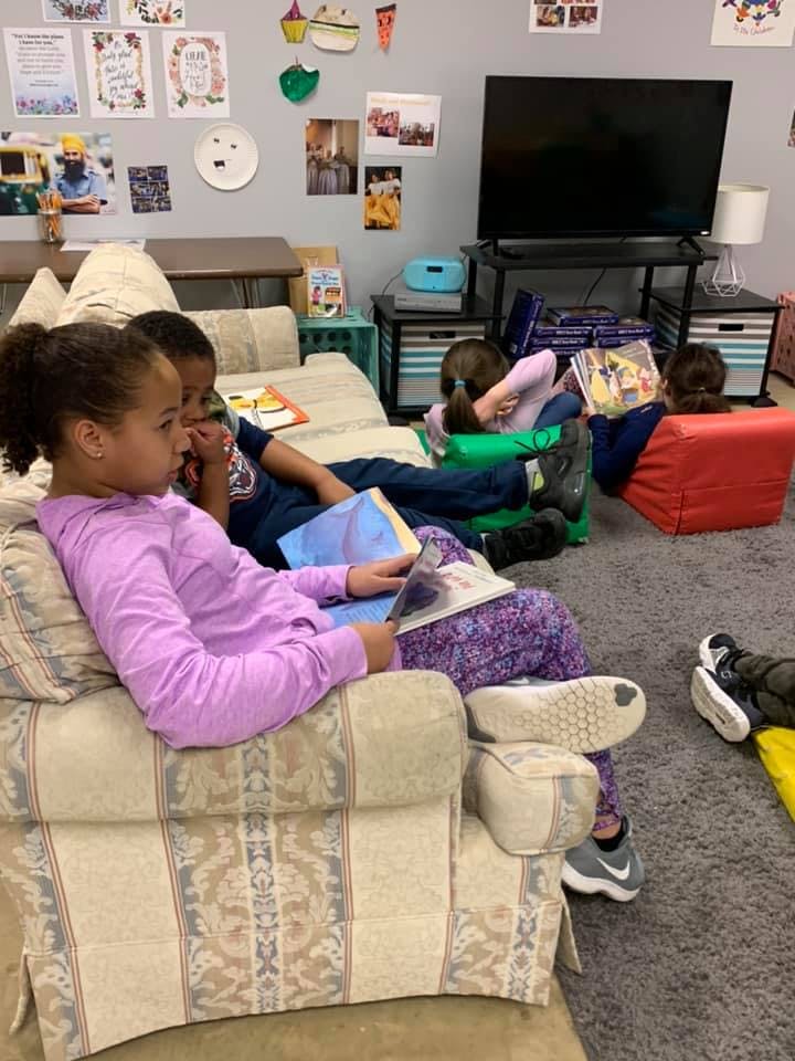 Children reading books in a classroom