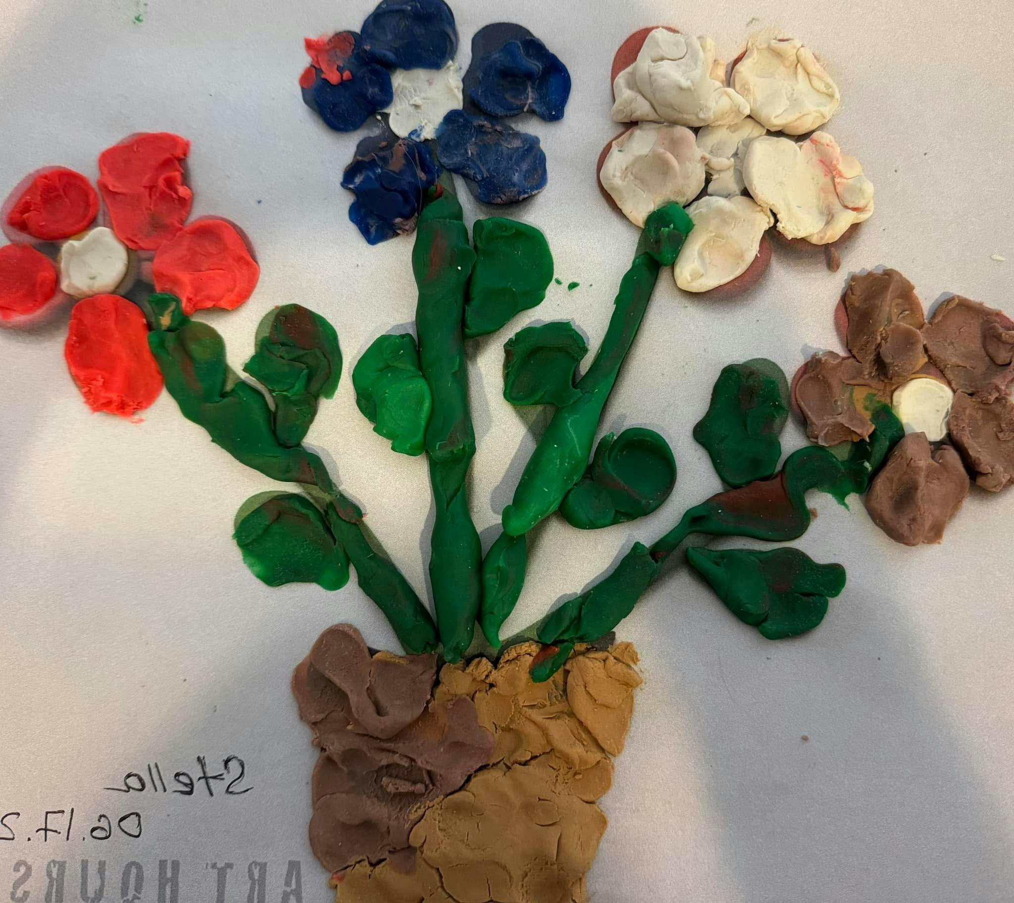 Play-Doh flower pot with green stems and colorful flowers