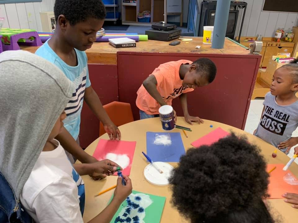 Children doing crafts at a table
