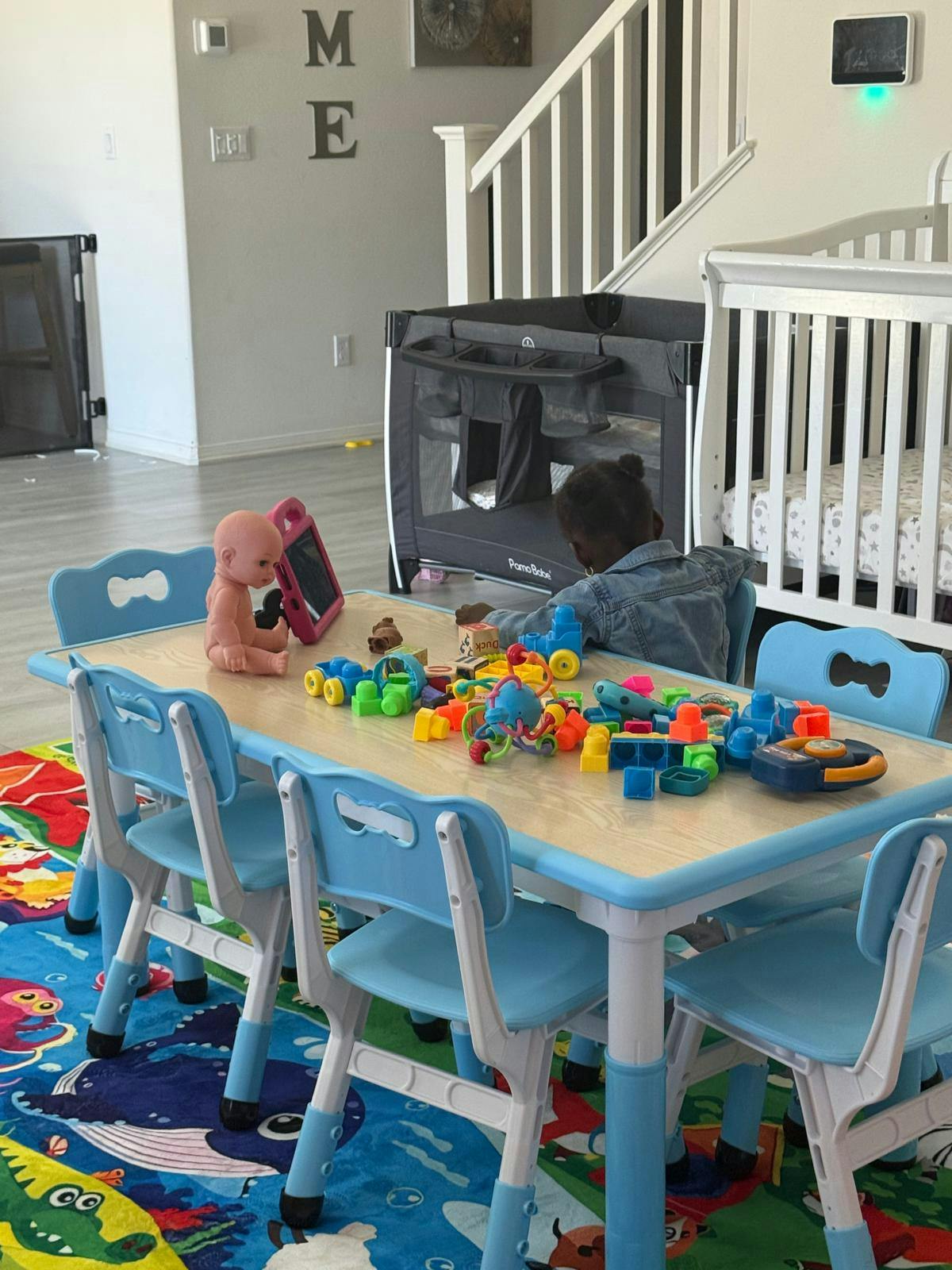 Child playing with toys at a small table