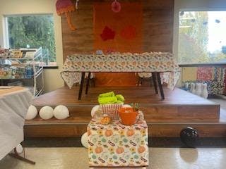 Table with Halloween decorations and treats