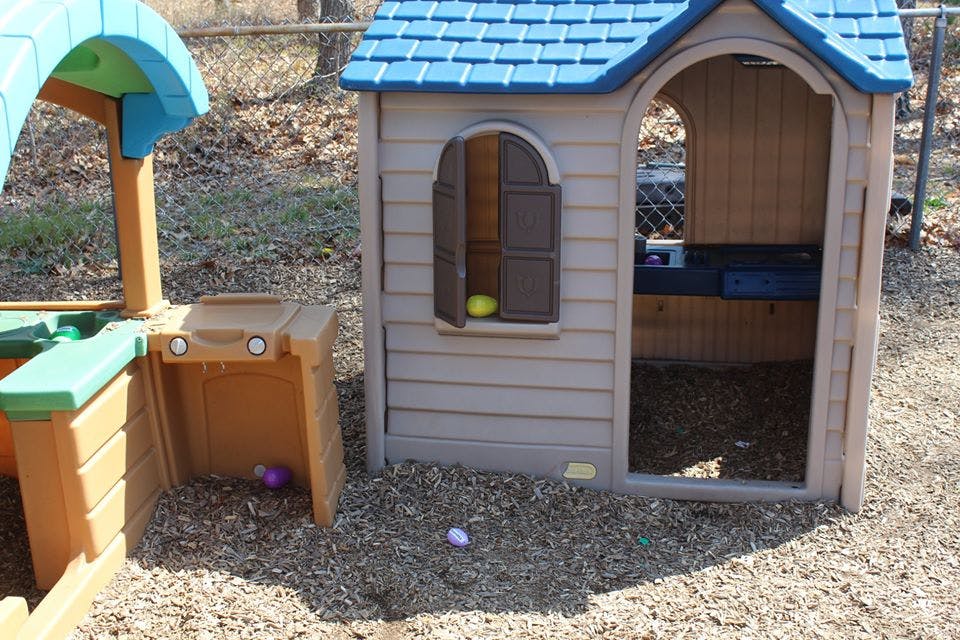 Playhouse and sand table on wood chips