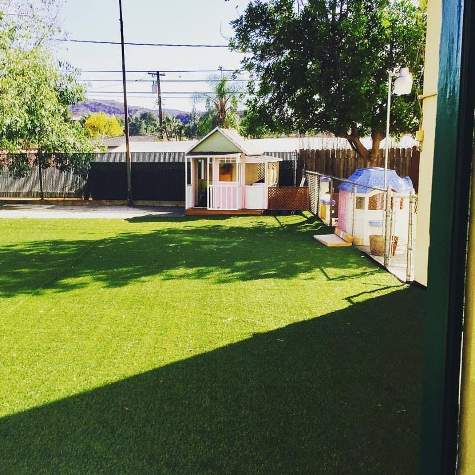 Playhouses on a grassy lawn