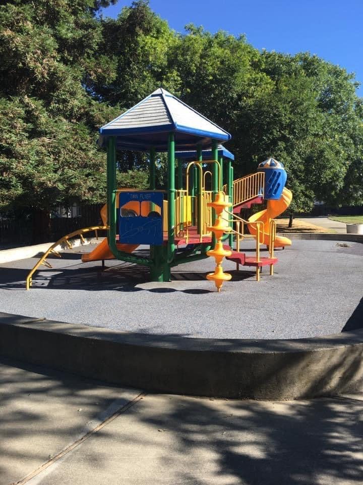 Colorful playground structure with slides and stairs