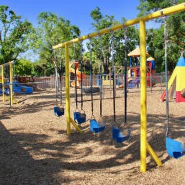 Empty swings on a playground