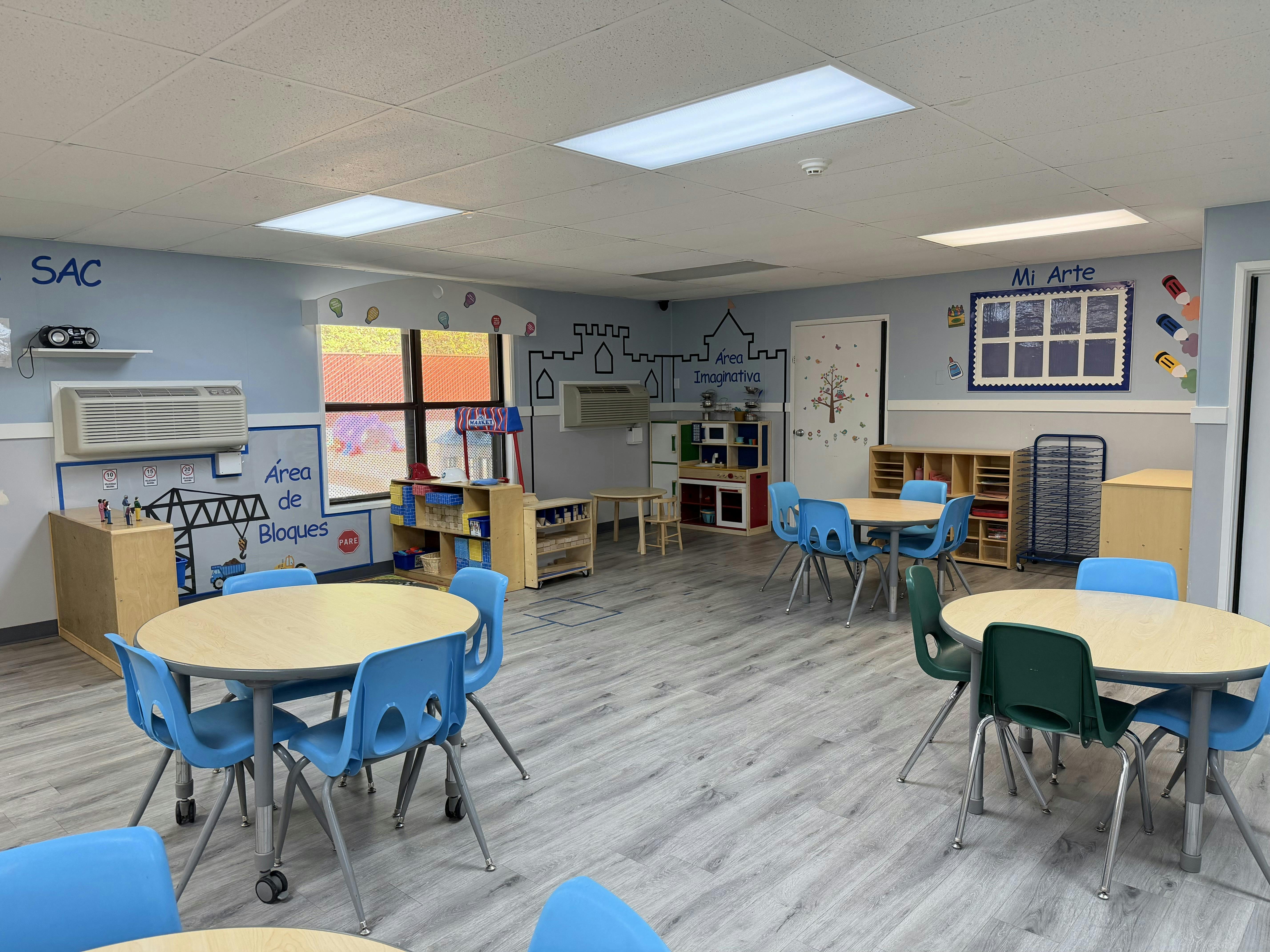 Classroom interior with small tables and chairs for children