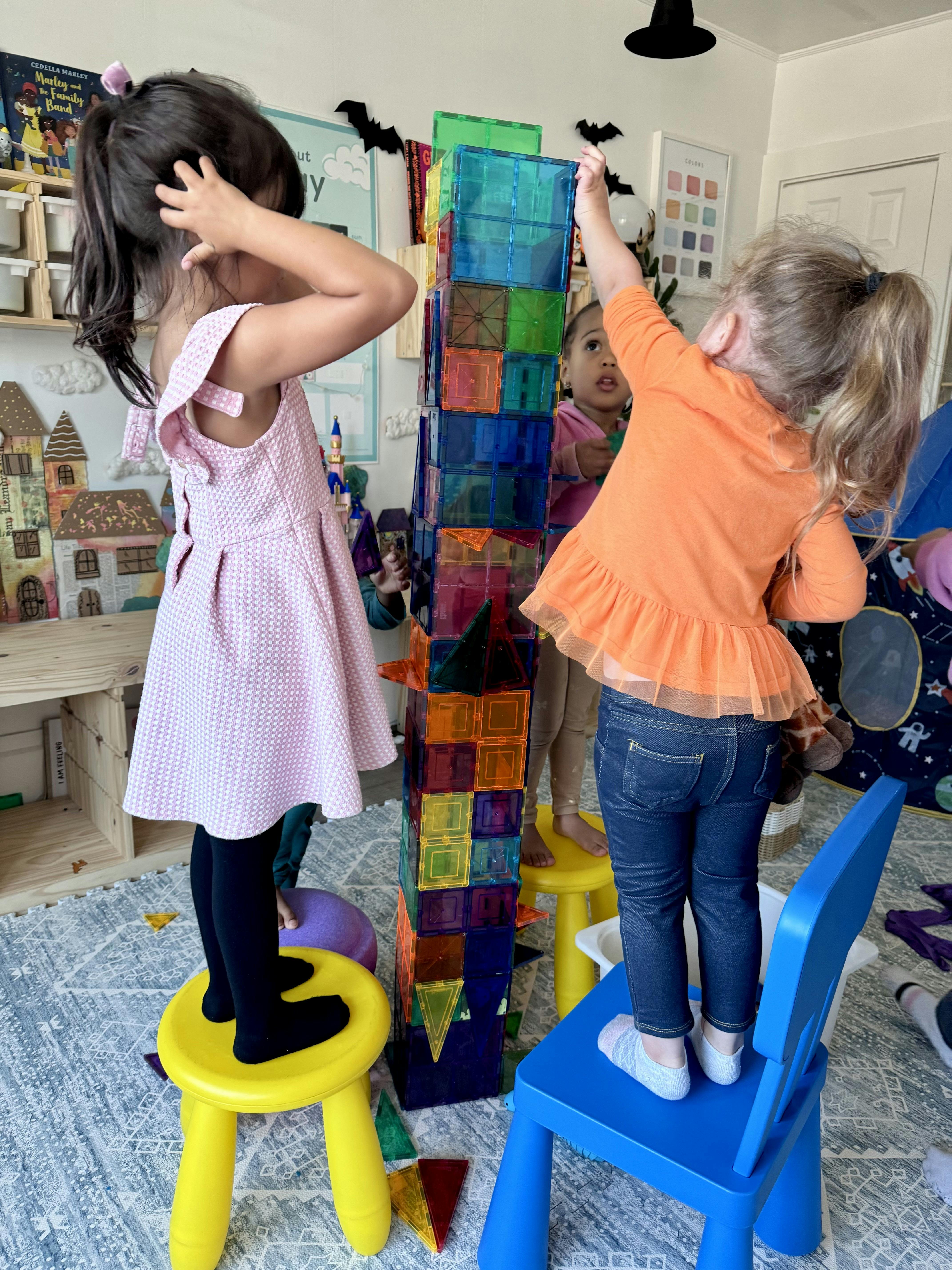 Children playing with colorful magnetic tiles