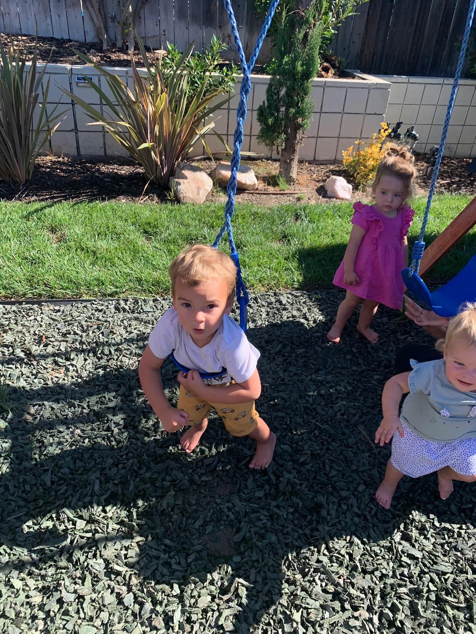 Three children on a playground